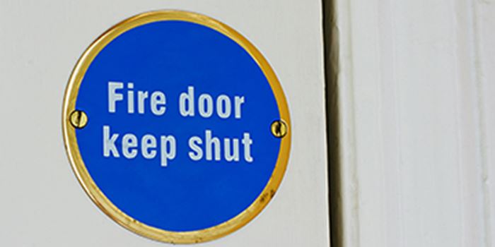 Fire door sign on white door