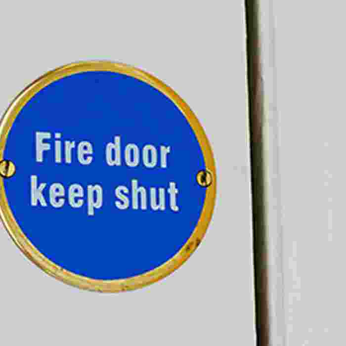 Fire door sign on white door