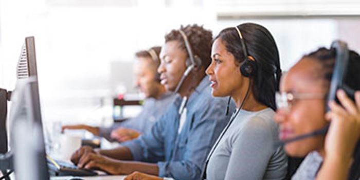 Side view of businesswoman working in call centre.