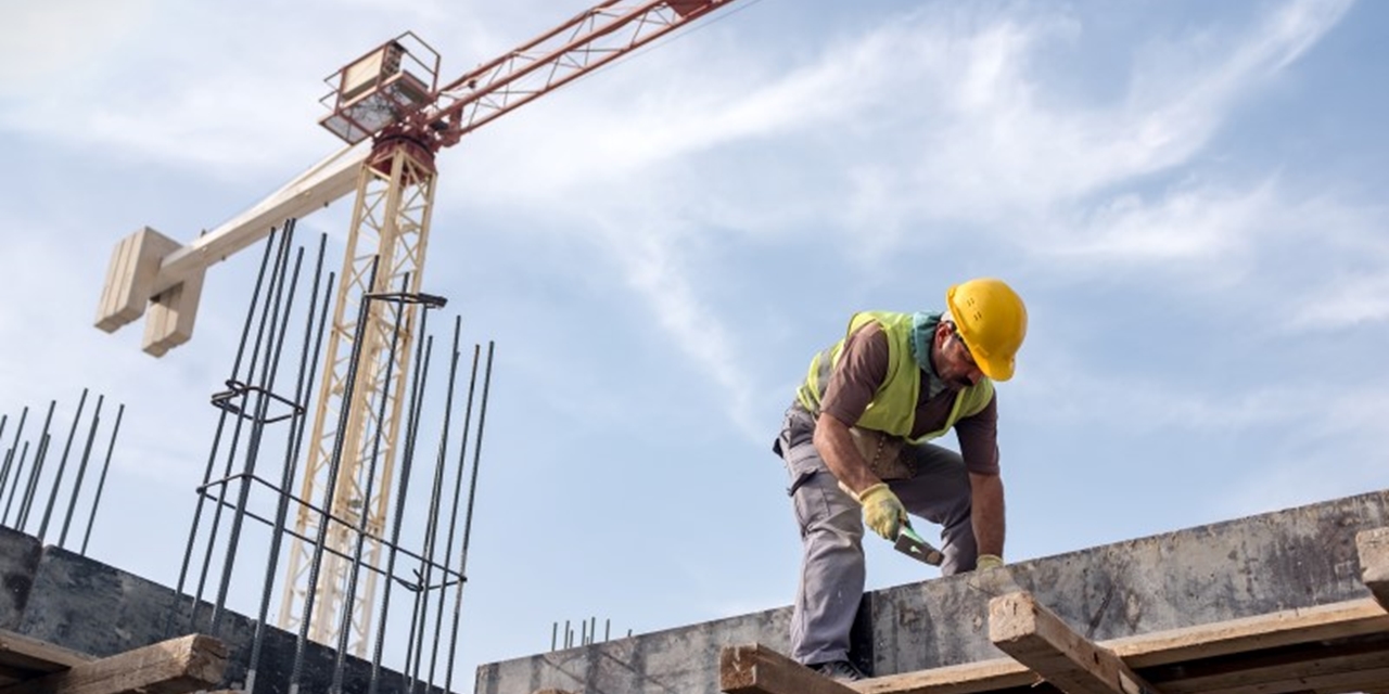 Worker in yellow hard hat on a construction site