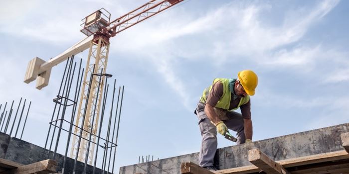 Worker in yellow hard hat on a construction site