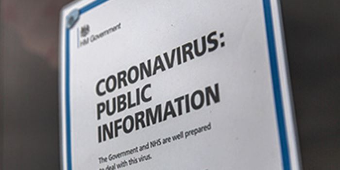 Sign on door with information on coronavirus