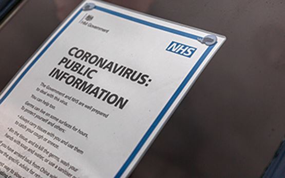 Sign on door with information on coronavirus