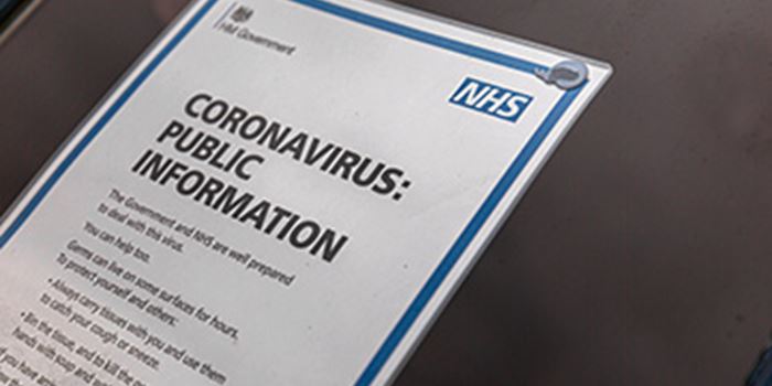 Sign on door with information on coronavirus