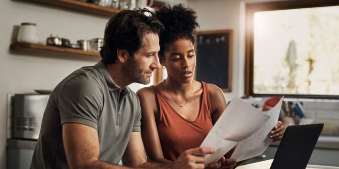 Couple sorting bills