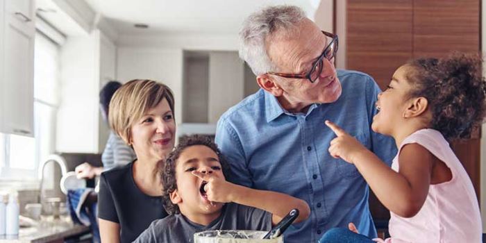 Mixed race family having fun and baking in the kitchen