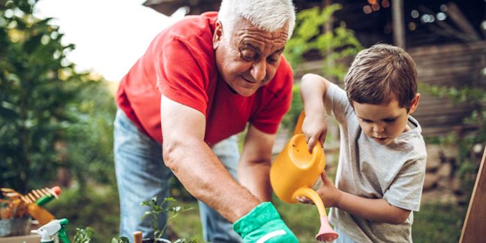 Grandparent and grandchild in the garden