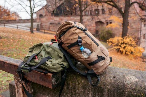 Backpacks on wall in a rural area