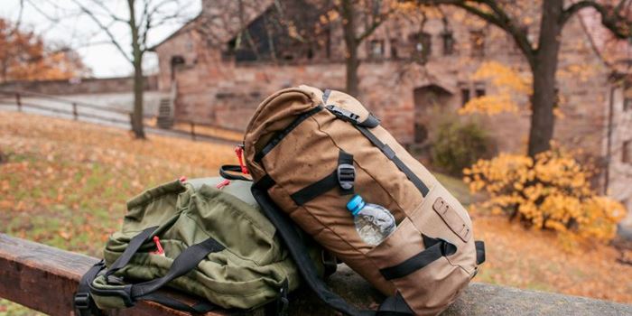 Backpacks on wall in a rural area