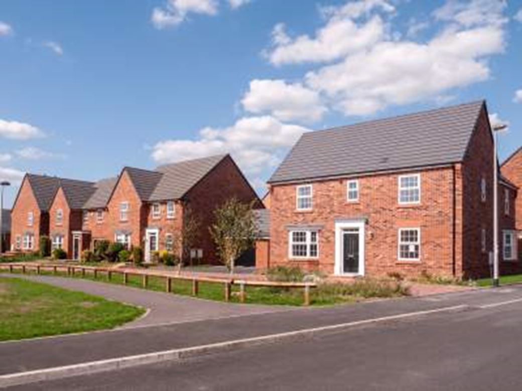 View of new build homes with a pathway in front of them and a blue sky behind