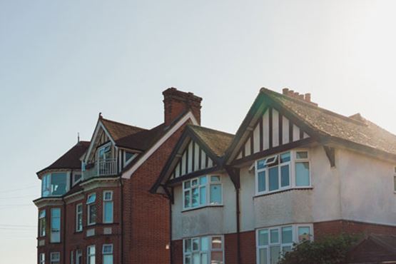 Hot sun beating down on roofs of houses
