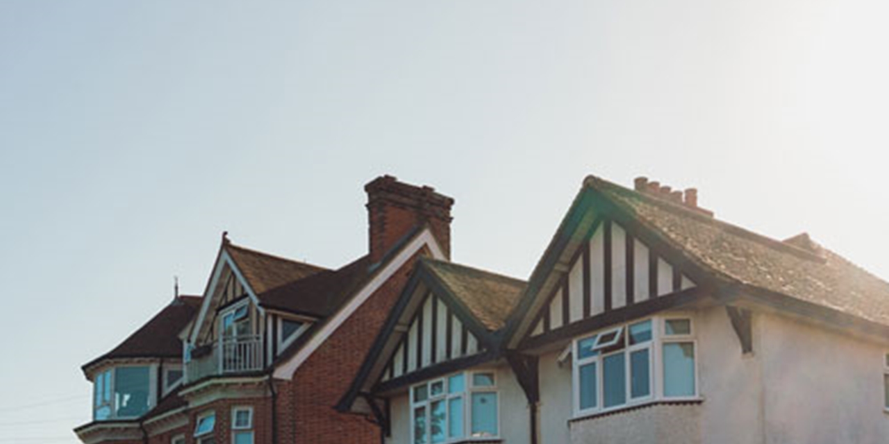Hot sun beating down on roofs of houses