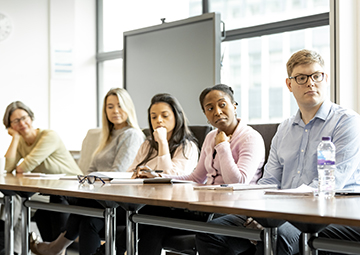 Staff listening to trainer