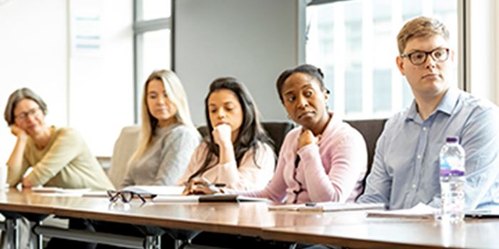 Staff listening to trainer