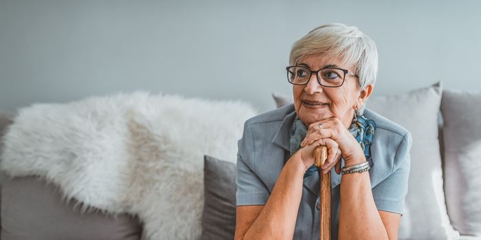 Older woman with walking stick