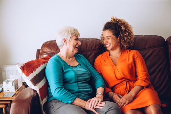 two people talking in a home